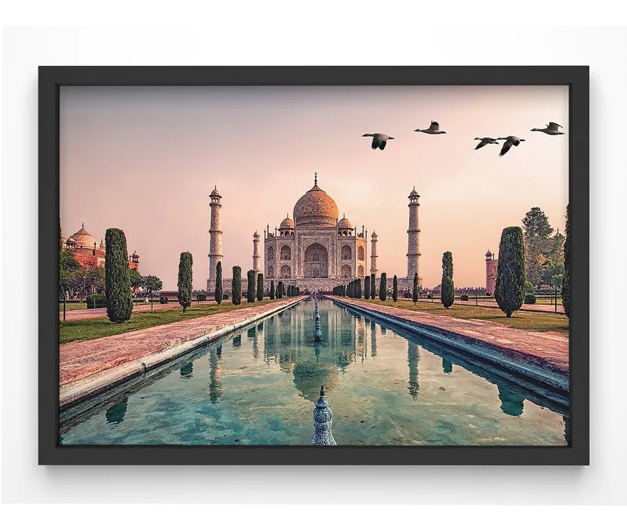 A high-quality giclée print of the Taj Mahal at sunset, featuring warm golden tones and a tranquil reflection in the water.