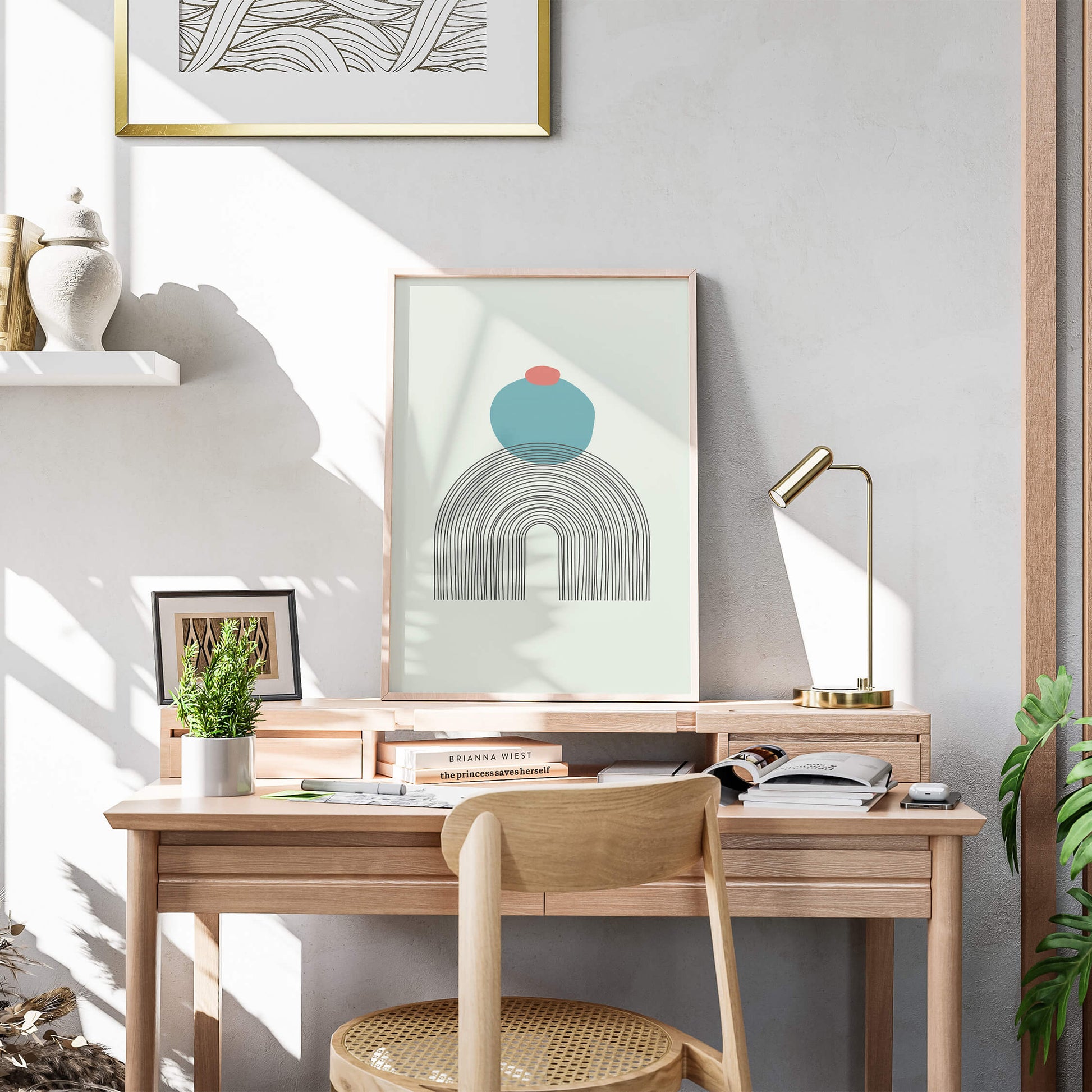 Arch Zenith Print framed in light wood, styled on a modern desk with natural sunlight and minimalistic decor.