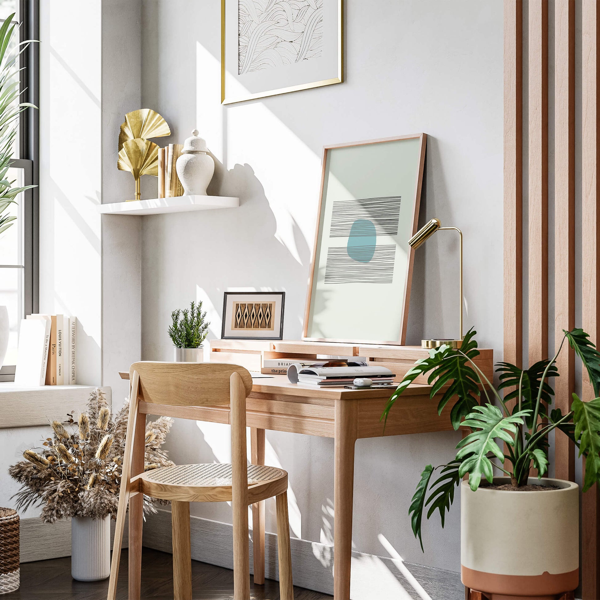 Azure Balance Print framed in light wood, displayed in a cozy workspace with greenery and natural sunlight.