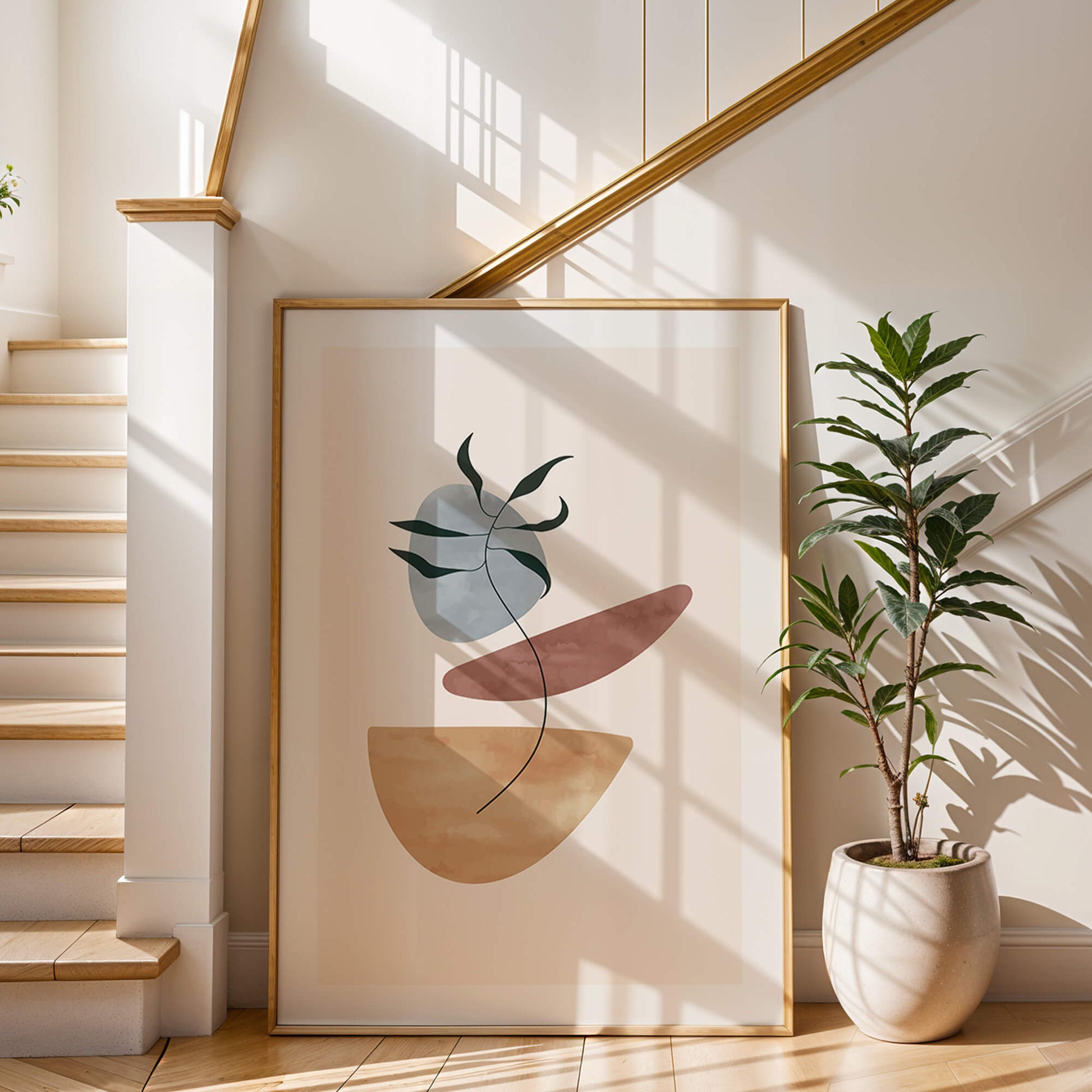 Large framed palm abstract print styled by a staircase with warm natural light.
