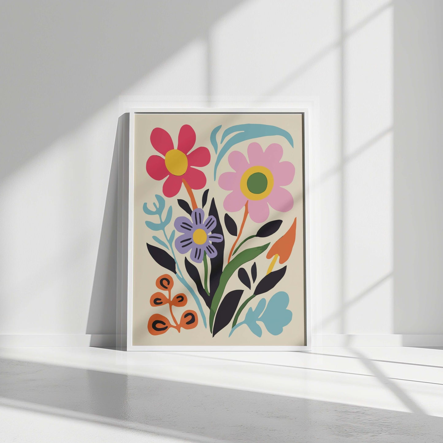 White-framed Bloom Joy abstract floral print displayed with natural light casting soft shadows.
