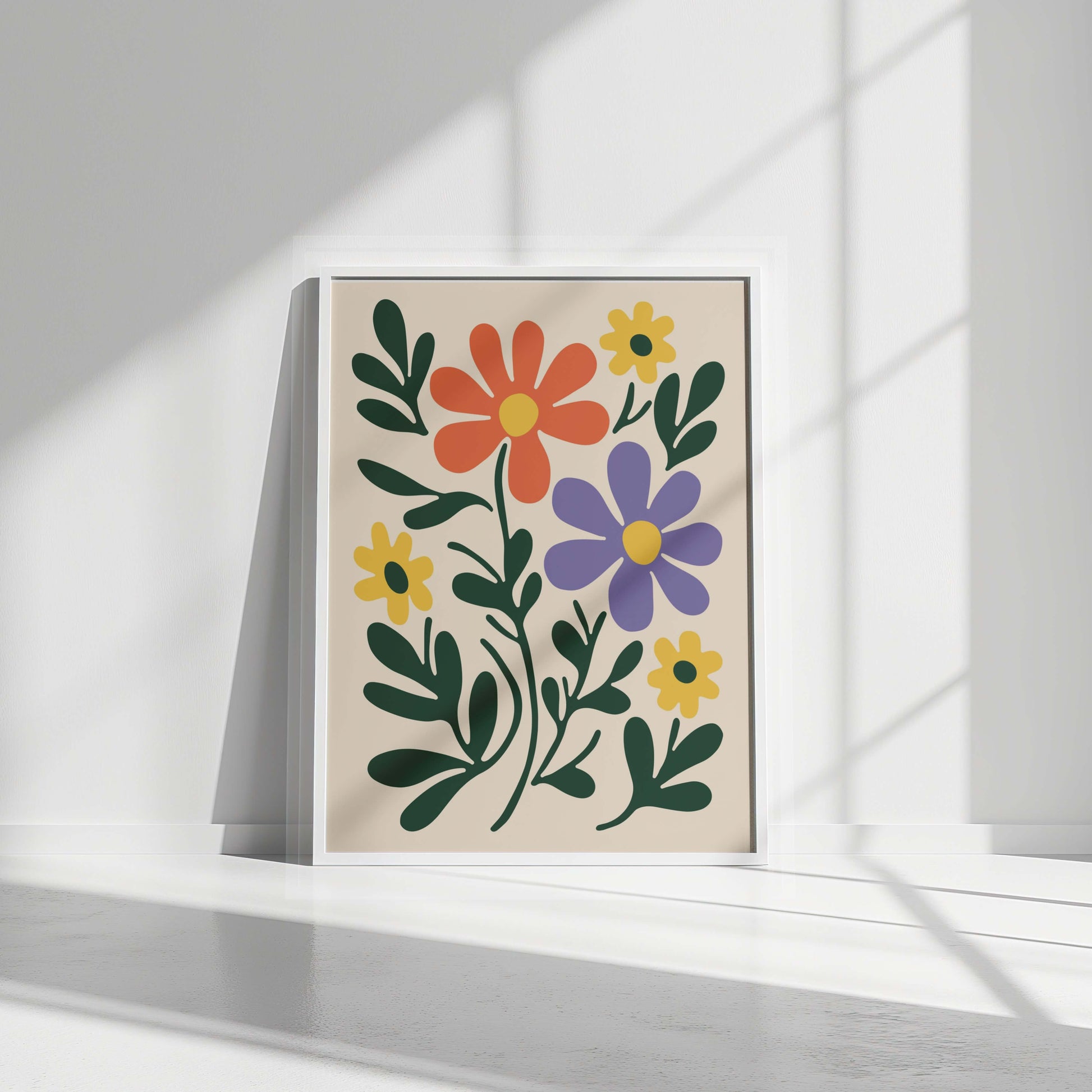 The floral print in a sleek white frame, positioned in a bright, minimalist setting.
