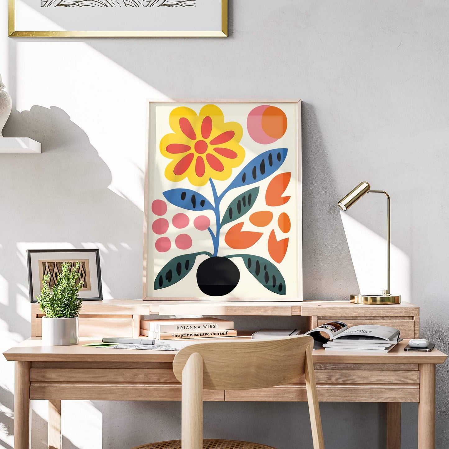 Bold Blooms abstract floral print displayed elegantly on a wooden desk with warm lighting.
