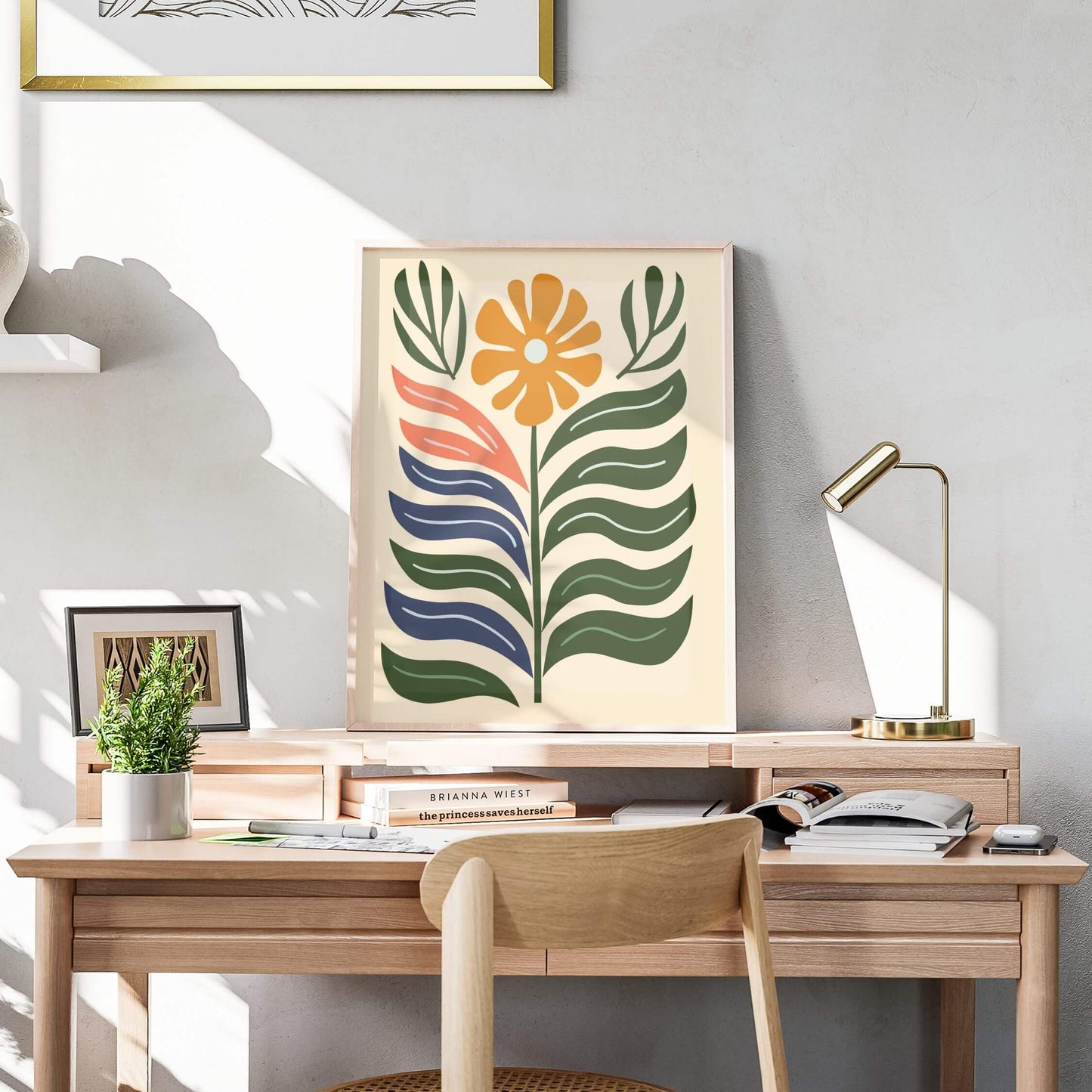 Bold Bloom Modern abstract print displayed on a wooden desk with warm natural lighting.
