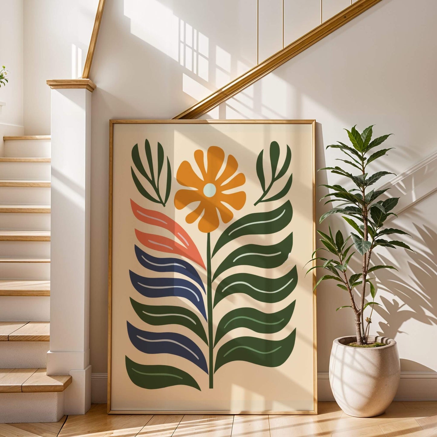 Large framed Bold Bloom Modern wall art leaning against a staircase wall, bathed in sunlight.
