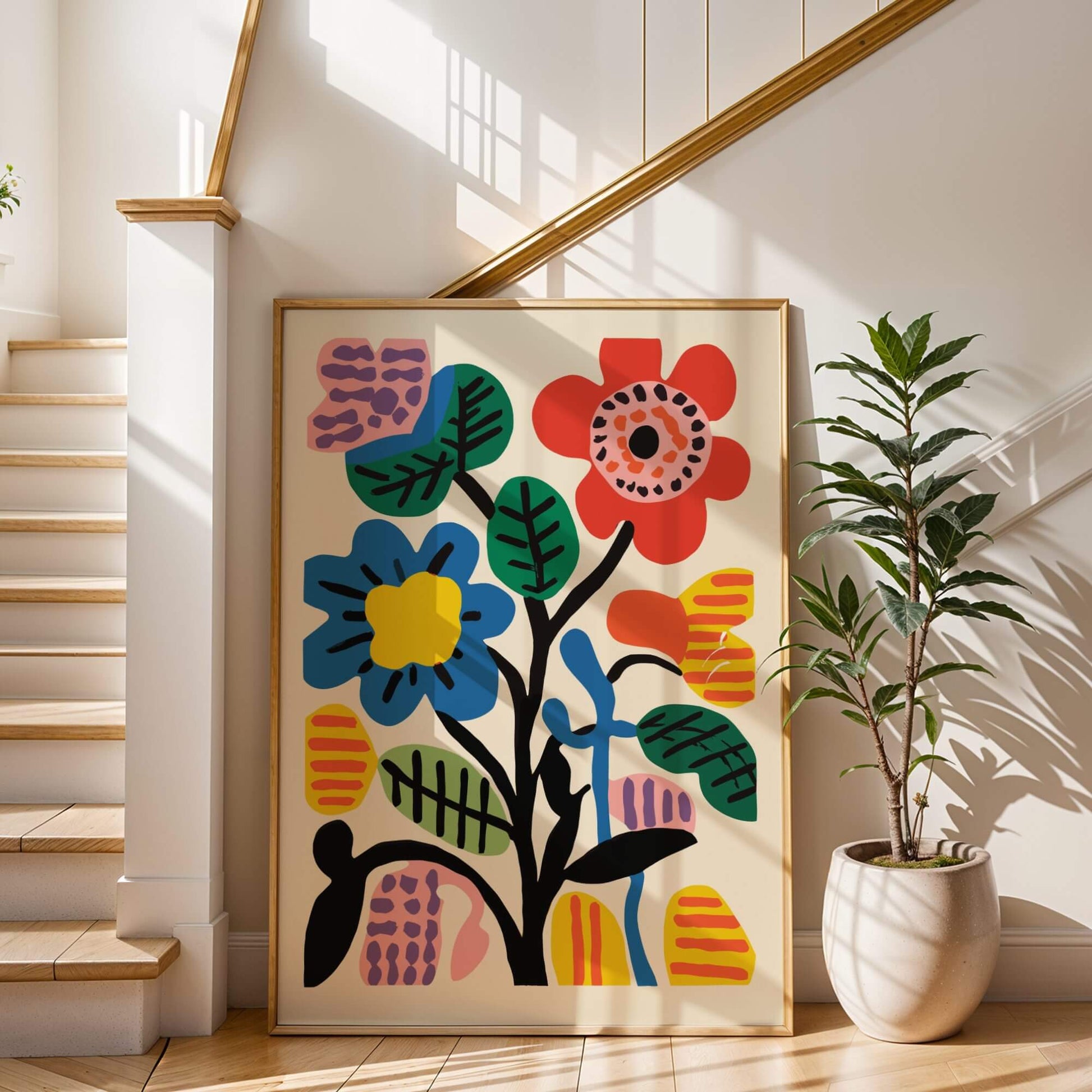 Large framed Bold Botanic Abstract artwork leaning against a staircase wall, bathed in warm light.
