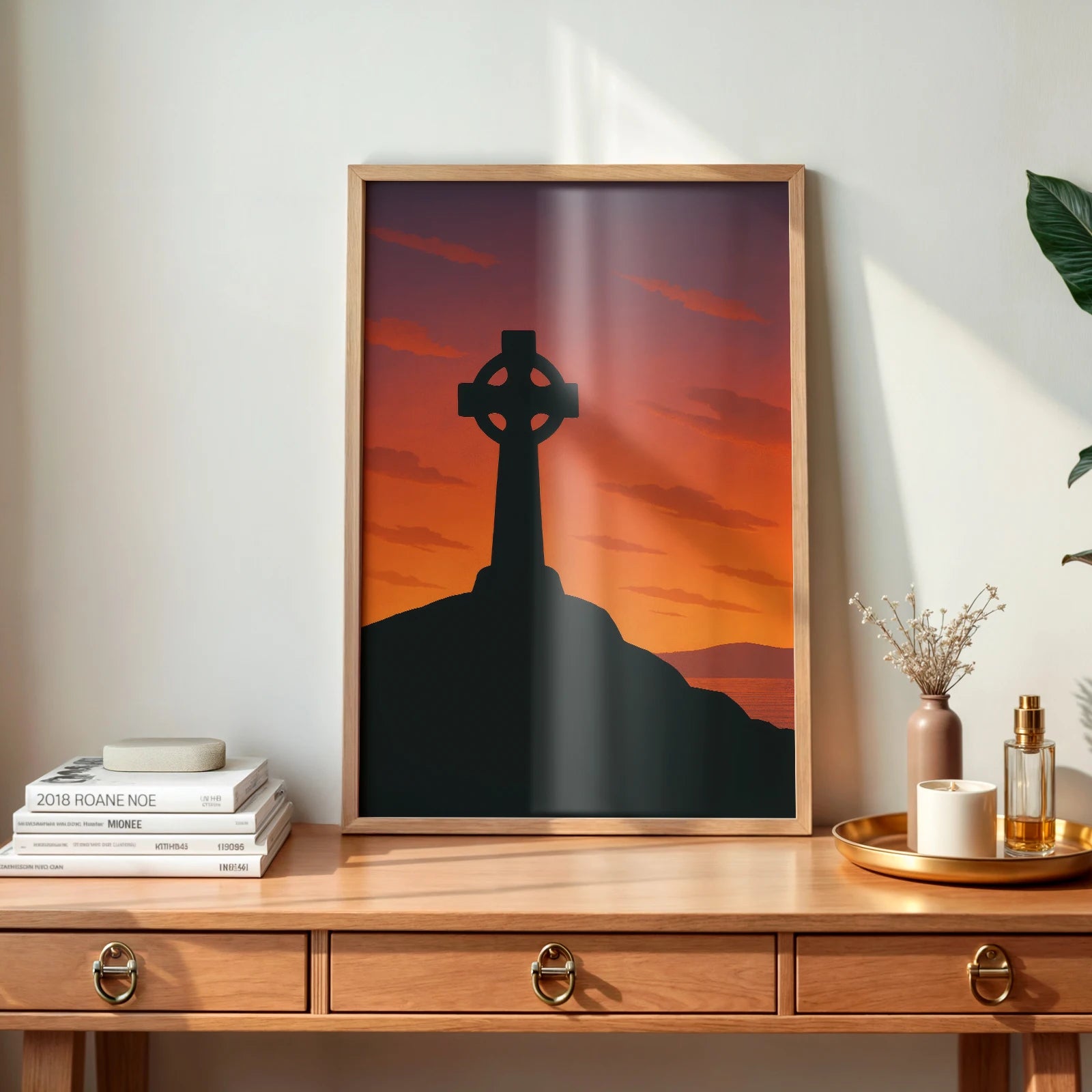 Framed Celtic Cross wall art on a wooden desk with natural light and minimal decor – inspired by Irish mythology.