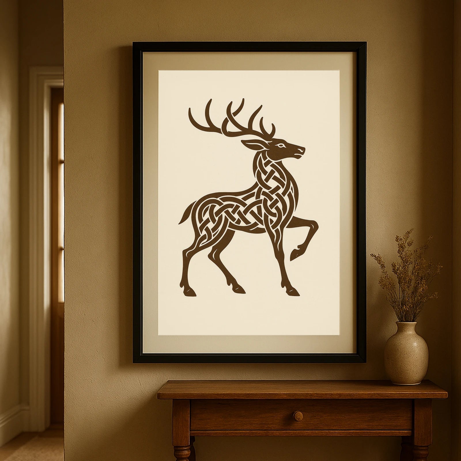 Black-framed Celtic knotwork stag print hanging in hallway with warm tones, rooted in Irish mythology.