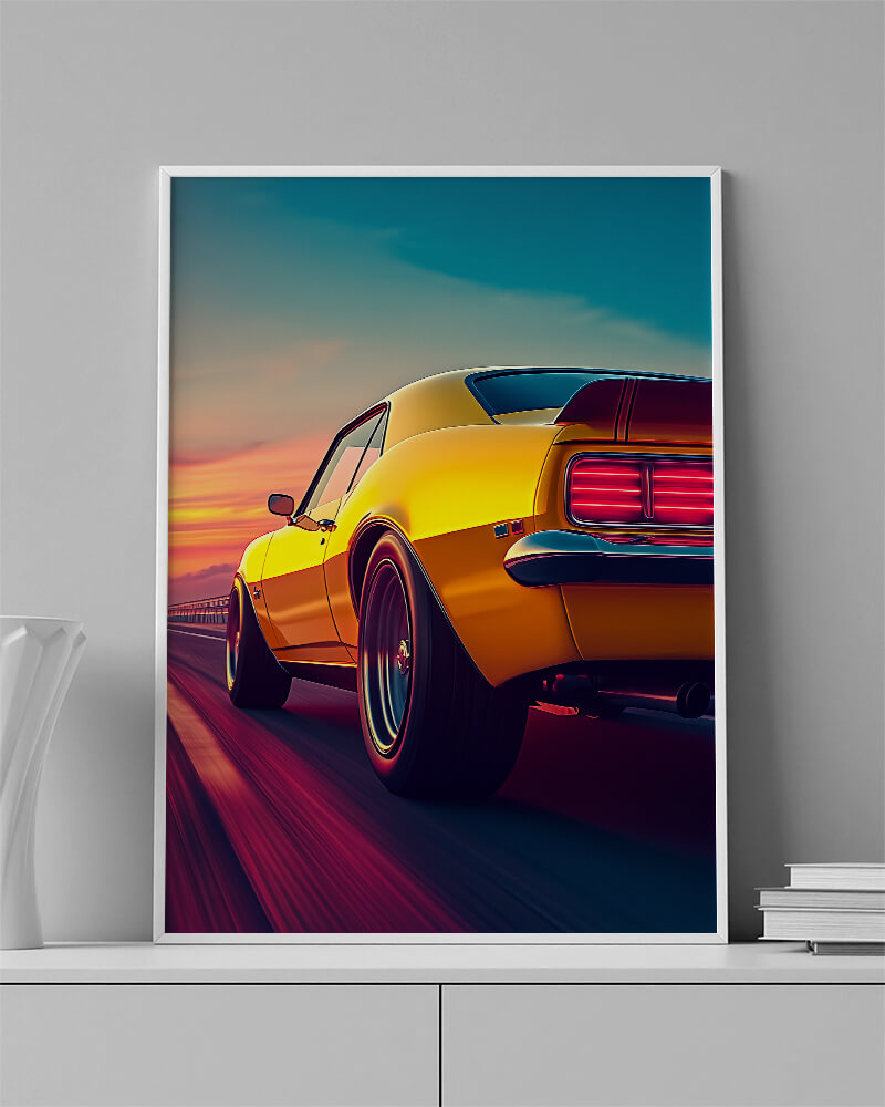 Chevrolet Camaro wall art featuring a yellow muscle car speeding on an open road at sunset.