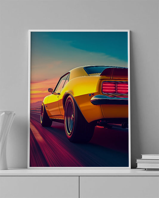 Chevrolet Camaro wall art featuring a yellow muscle car speeding on an open road at sunset.