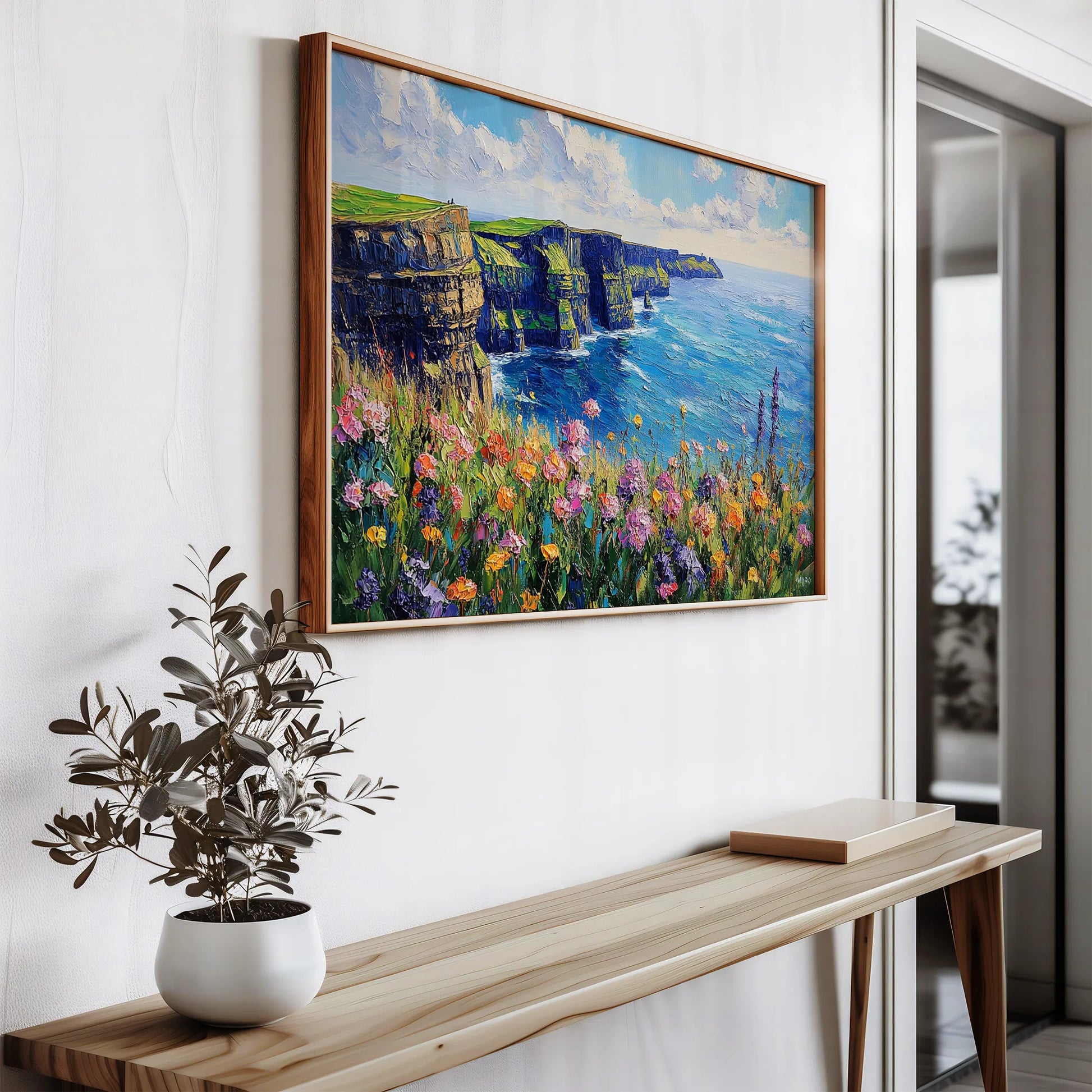 A close-up of the Cliffs of Moher wall art print, highlighting vivid blues, greens, and colorful wildflowers.