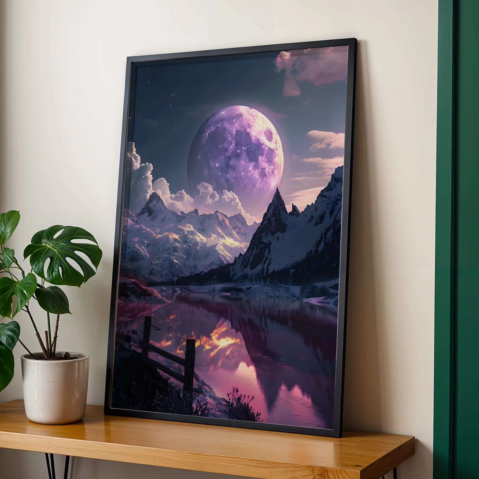 Purple-toned landscape art print of full moon over mountains.
