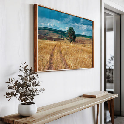 Nature-inspired wall art hanging on a minimalist white wall with wooden accents.

