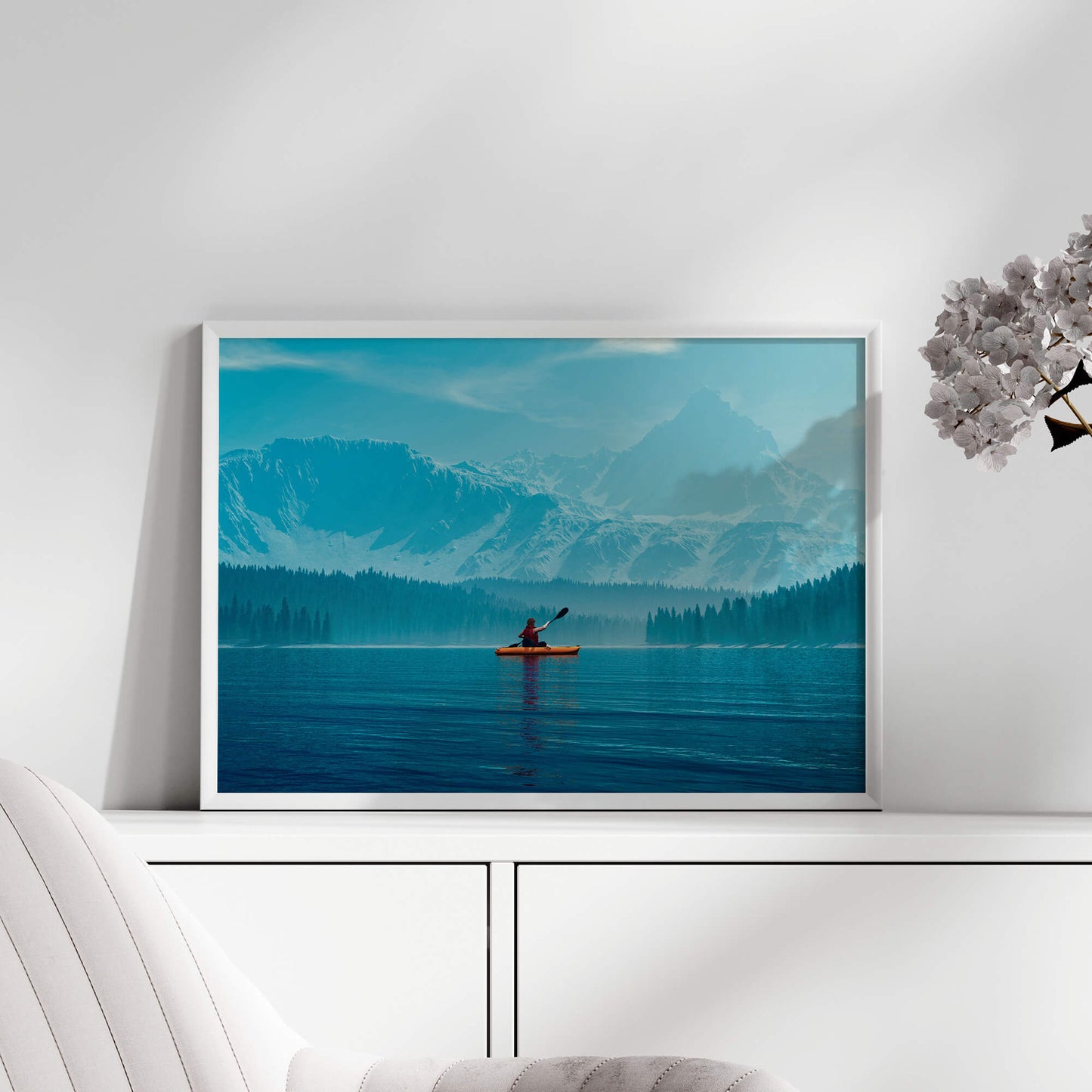 White-framed kayak explorer print displayed in a bright, airy room.
