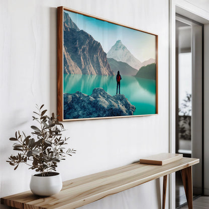 Large format landscape photography print in wooden frame, showing mountainous scenery with vibrant turquoise waters, styled with modern indoor plant decor for Irish living spaces