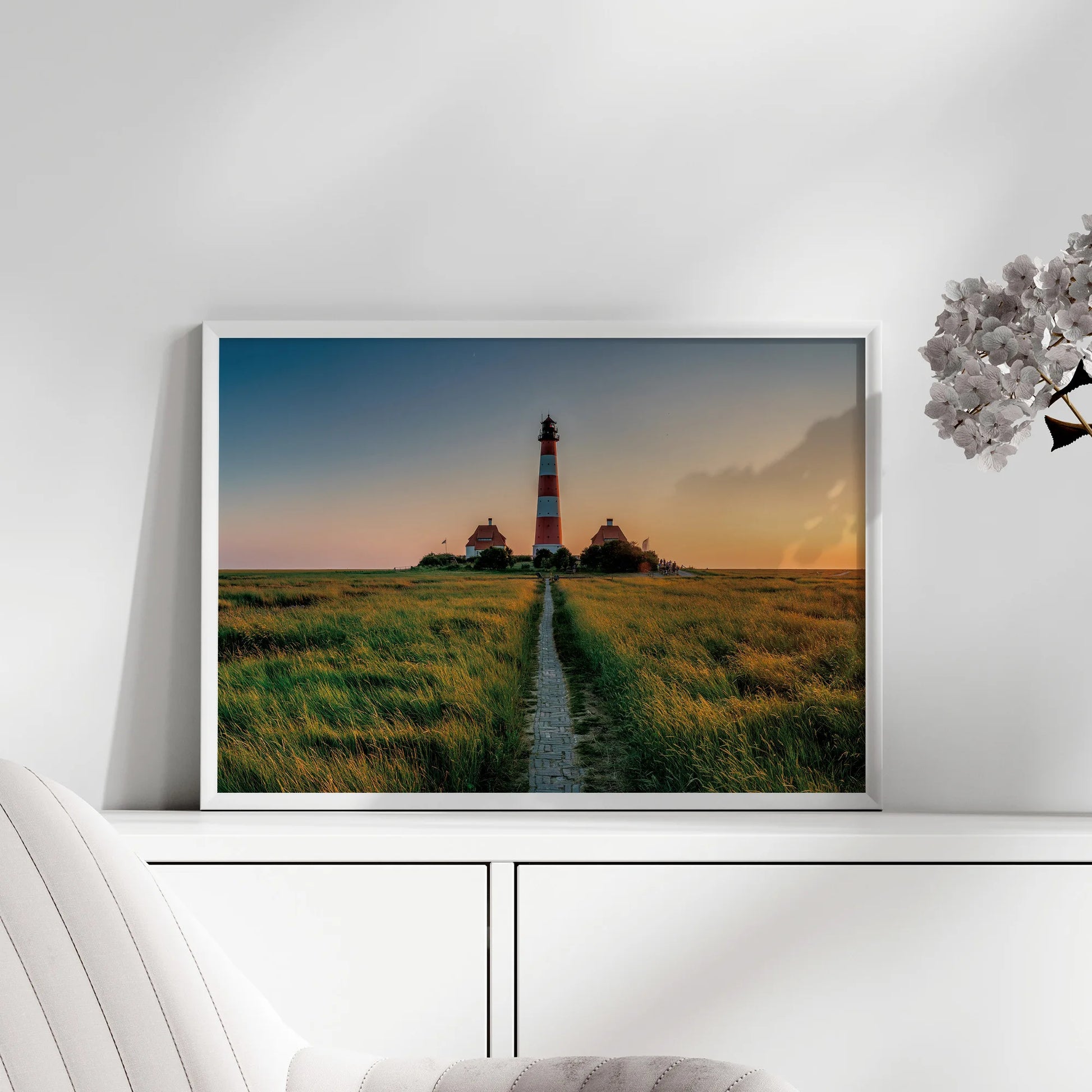 Lighthouse Path Framed Print displayed in hallway.