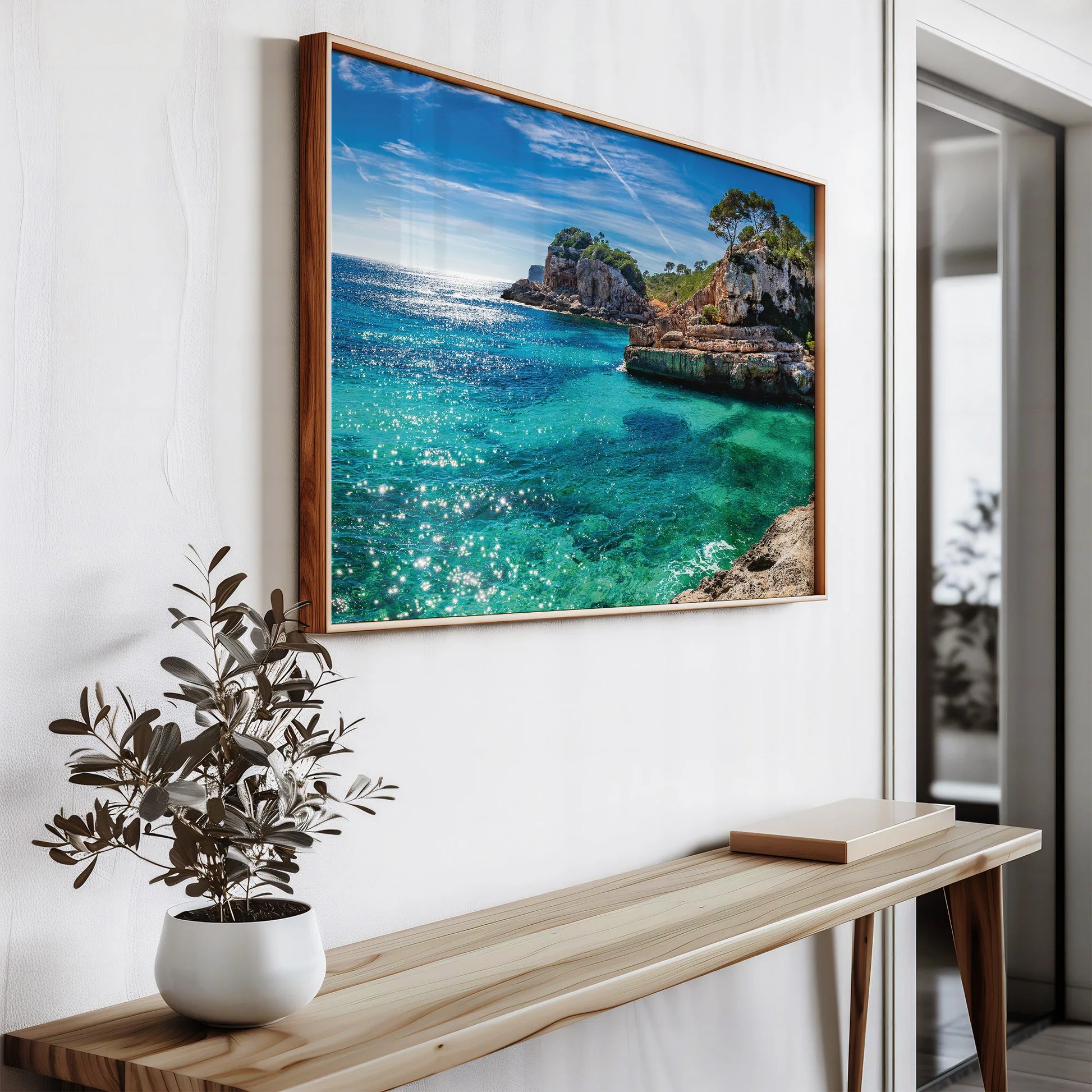 Mediterranean Cove Framed Print front view o a white minimalist decor.