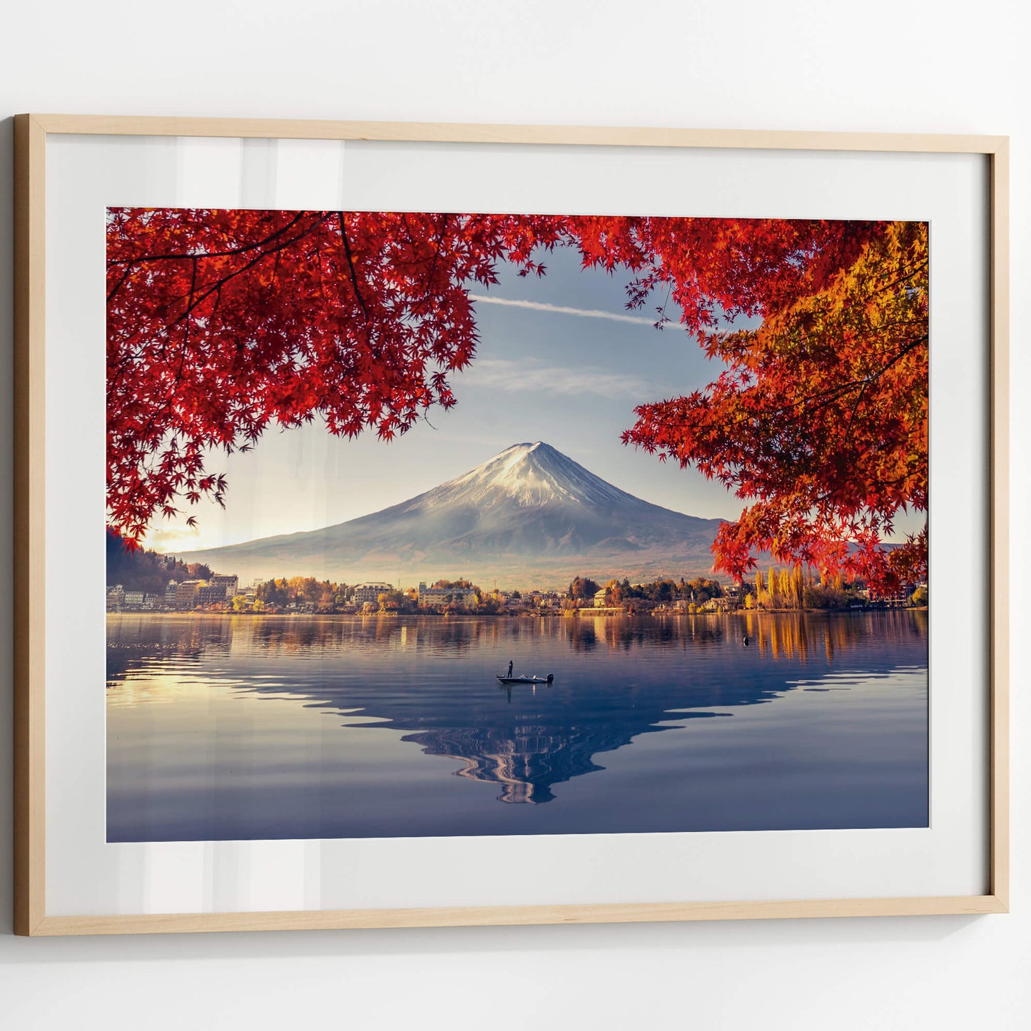 A detailed shot highlighting the vivid red and orange foliage with Mount Fuji’s snow-capped peak in the distance.