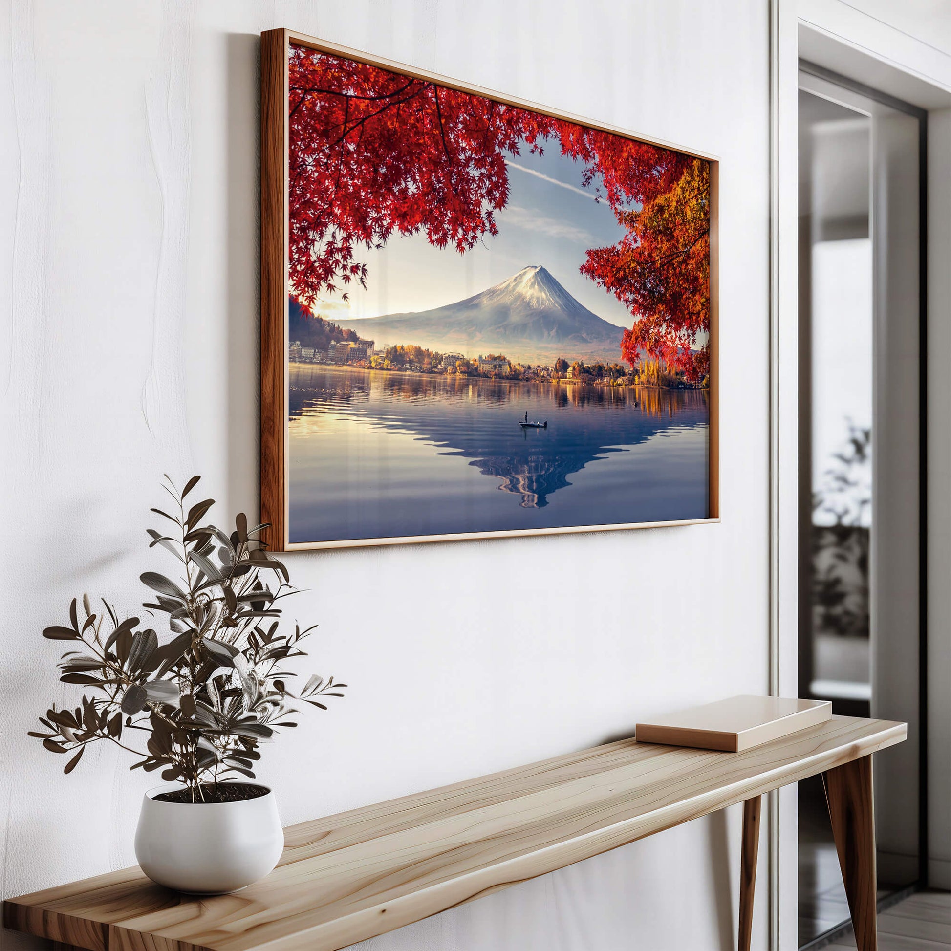 The artwork elegantly framed and mounted above a sleek console table, complementing a modern decor setting.