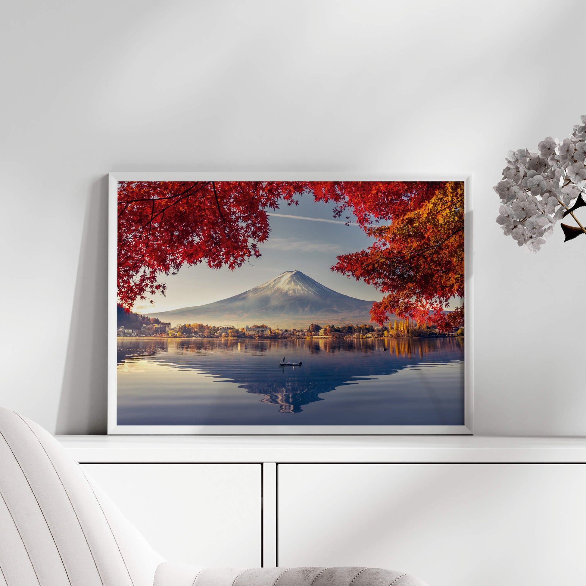 The Autumn Fuji print in a sleek white frame, positioned on a minimalist console table for a refined look.