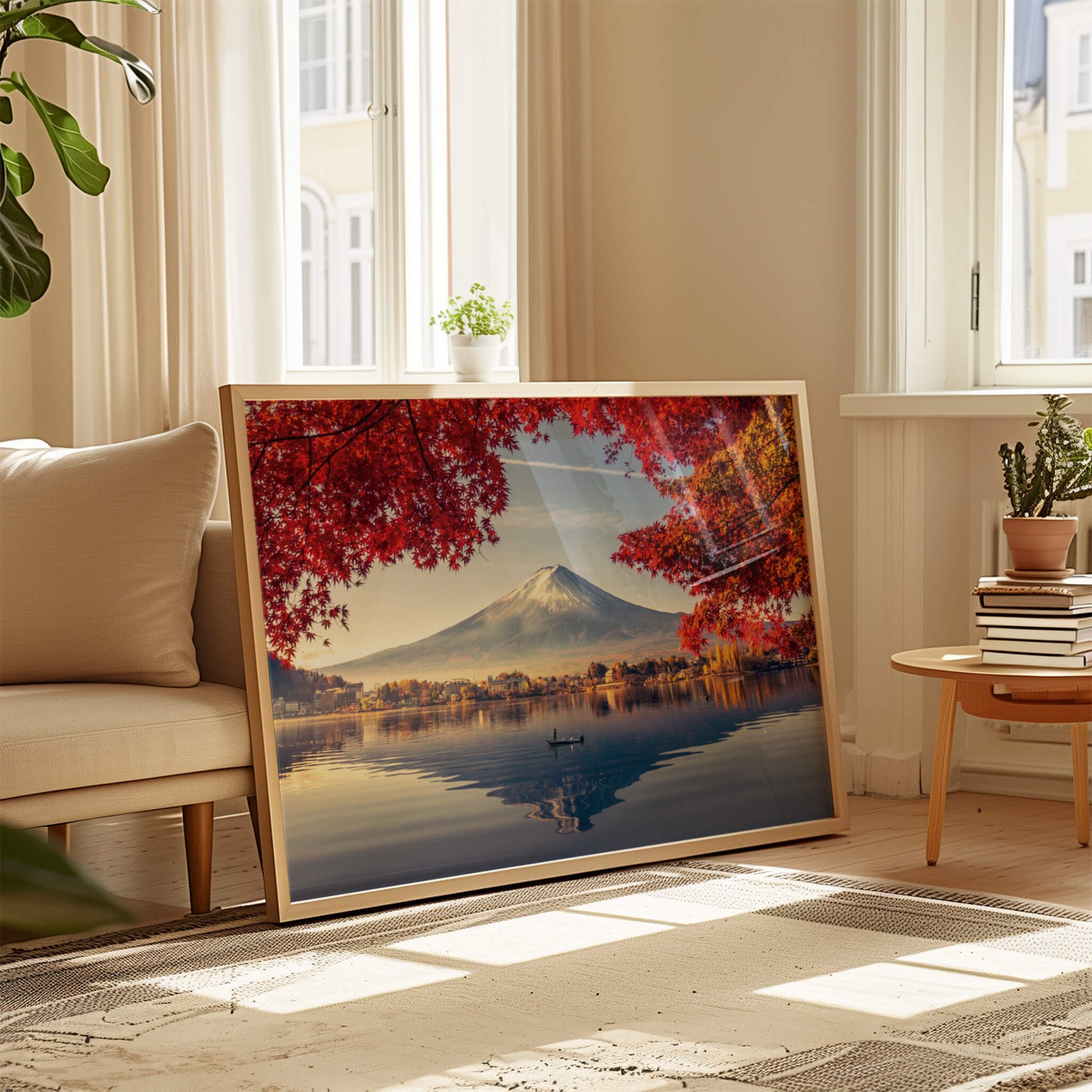 A warm wooden-framed version of the Autumn Fuji print, propped against a textured wall in a cozy corner.