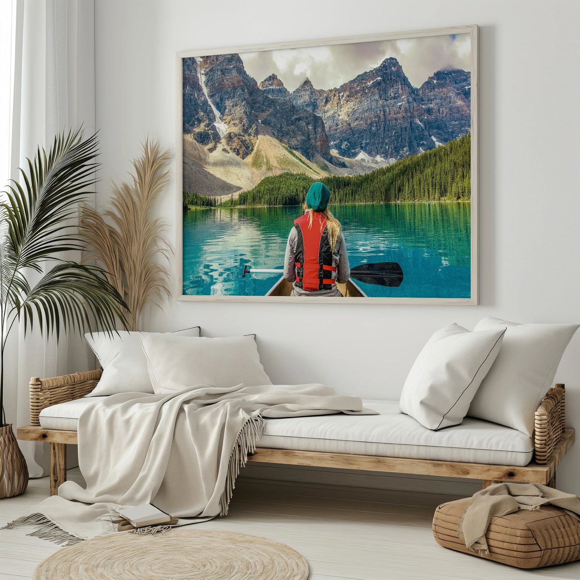 A contemporary decor setup featuring the Mountain Canoeing Print mounted on a textured wall.
