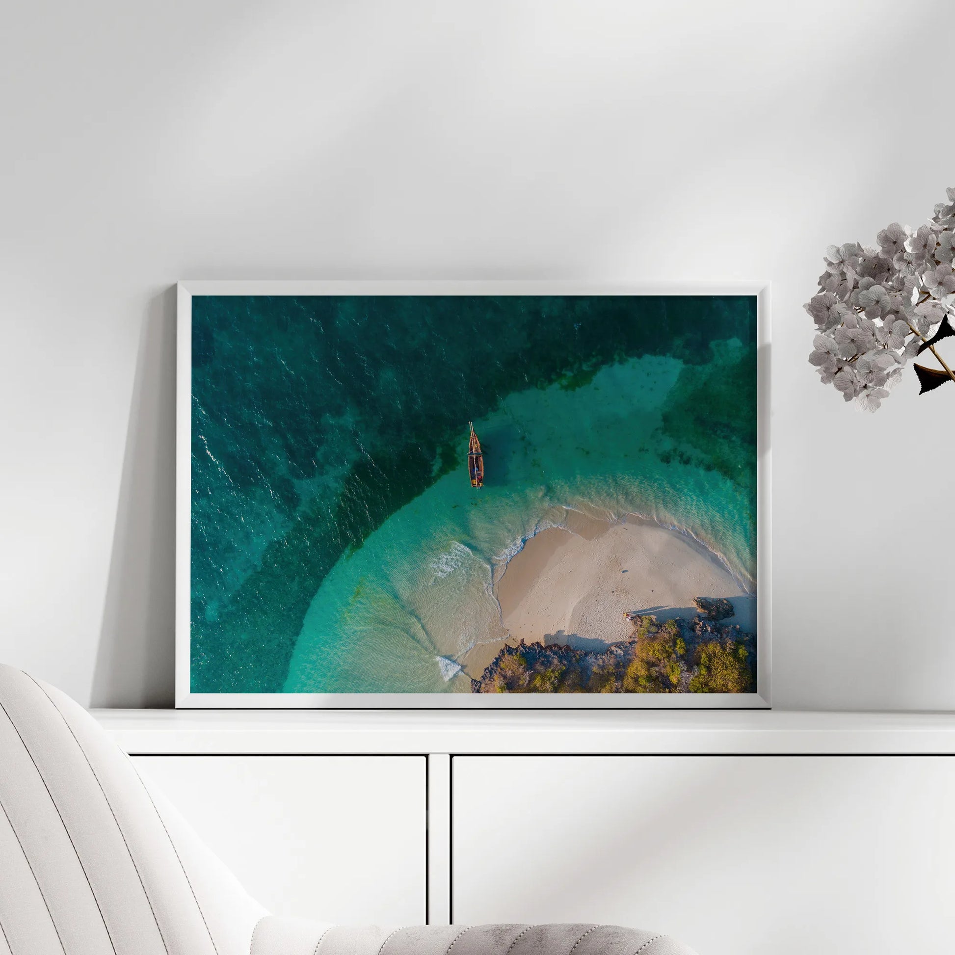 The Secluded Beach Print displayed in a modern living room, adding a tranquil coastal vibe to the space.