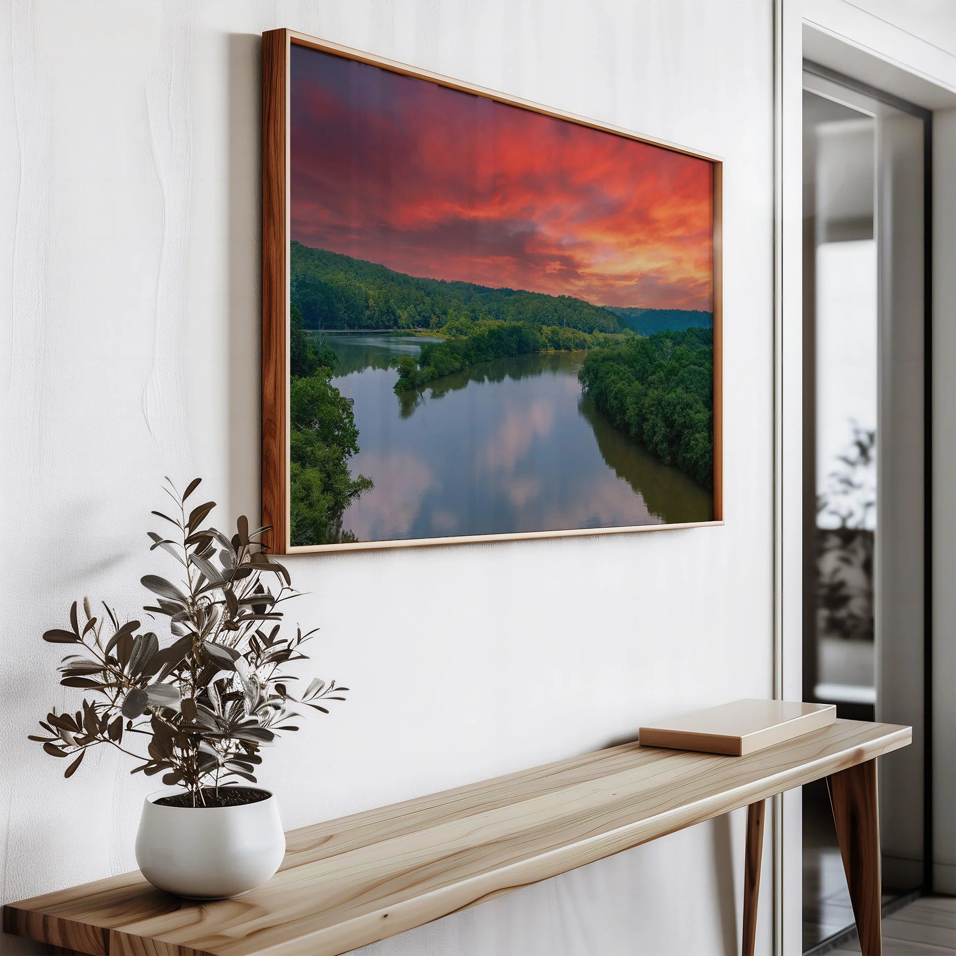 Sunrise River Framed Print standing on a desk.