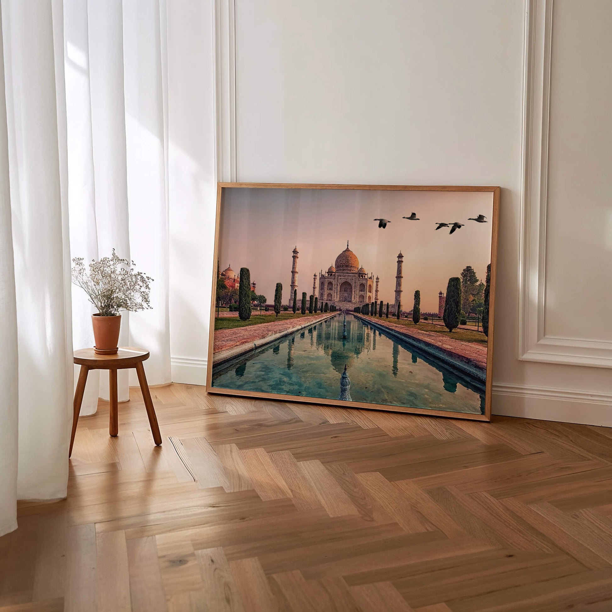 The Taj Mahal art print leaning against a wall, highlighting its ready-to-hang versatility.