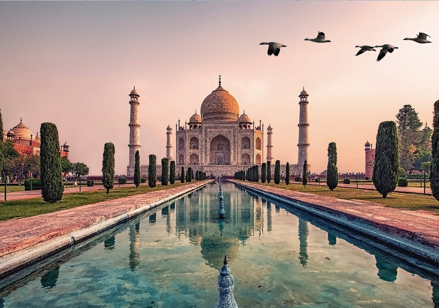 A high-quality giclée print of the Taj Mahal at sunset, featuring warm golden tones and a tranquil reflection in the water.