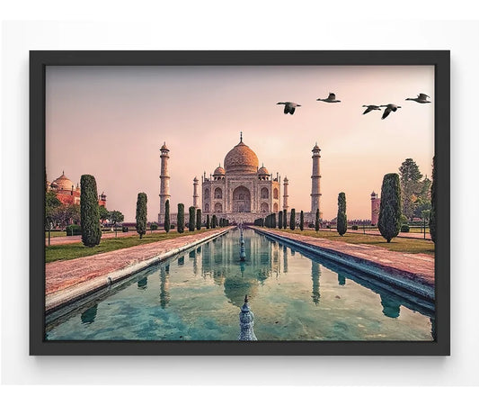 A high-quality giclée print of the Taj Mahal at sunset, featuring warm golden tones and a tranquil reflection in the water.