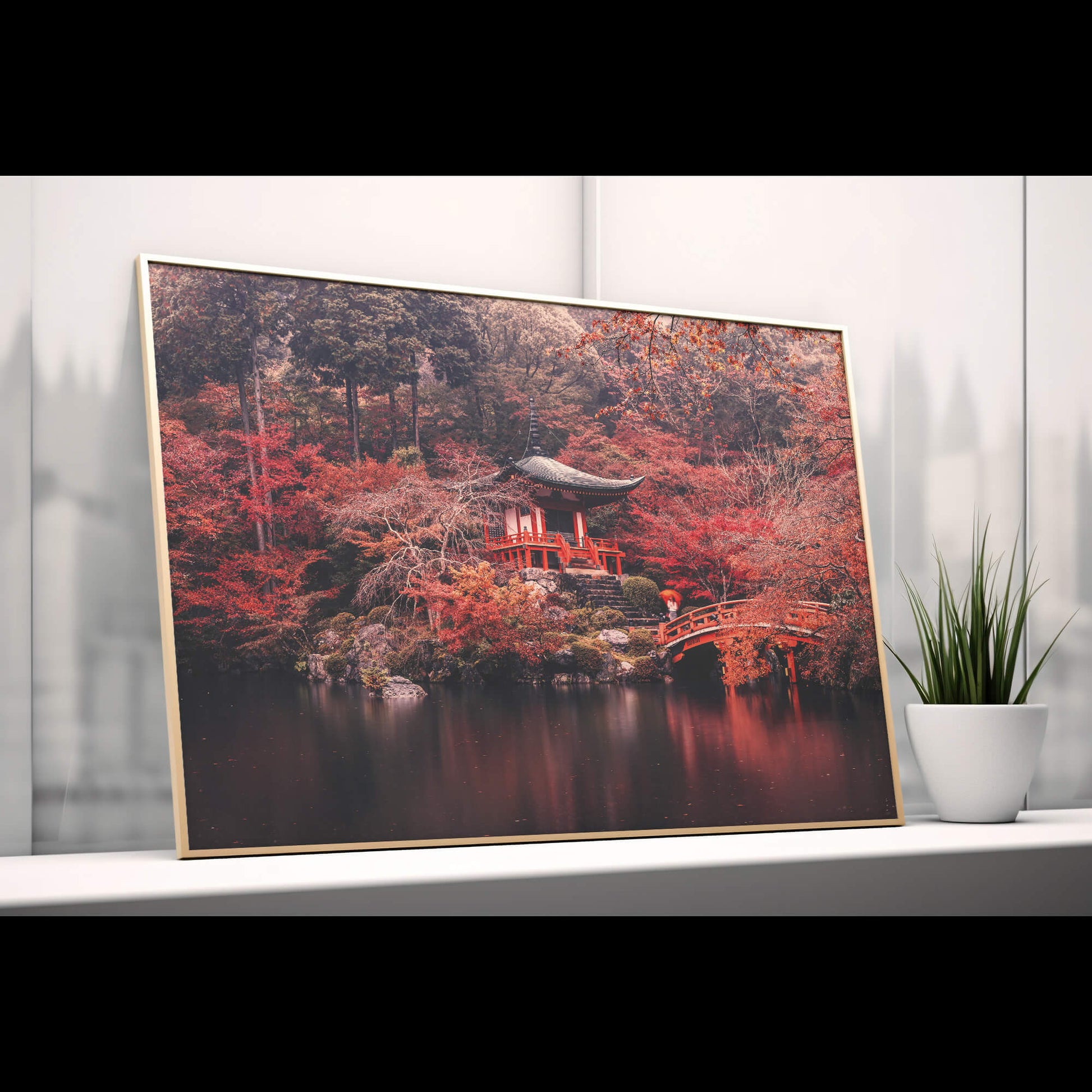 The Temple Reflection print displayed on a shelf, blending with natural decor elements.