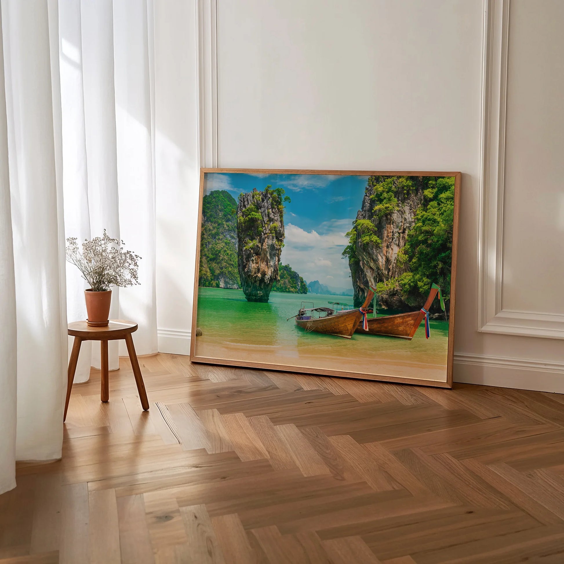 The framed Thai Longtail Boat print styled in a serene living room, adding a tropical touch. 