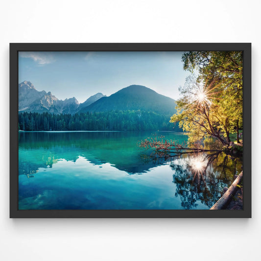 A breathtaking lake landscape print featuring clear turquoise waters, lush forest, and mountain peaks in the background.