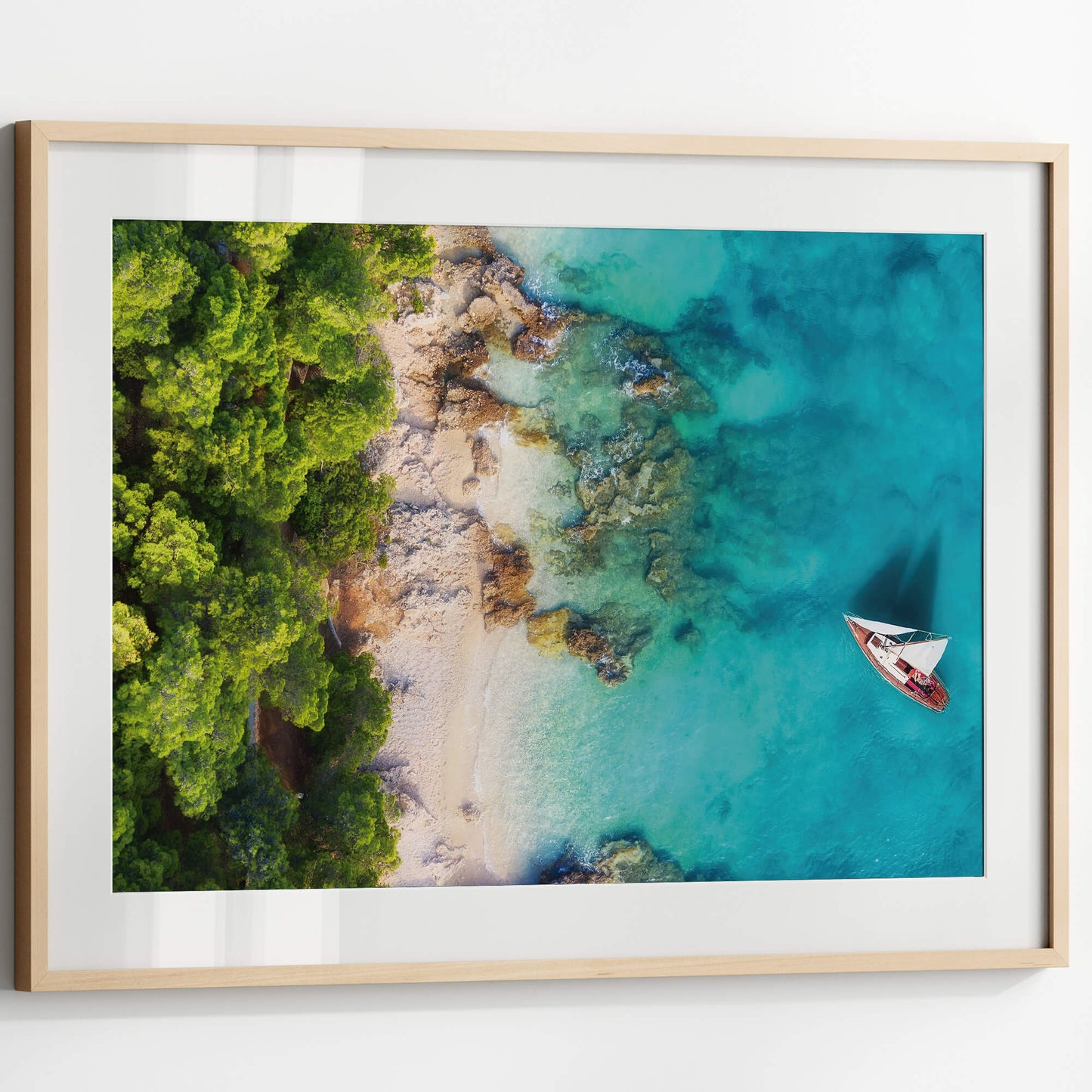 A close-up of the Tropical Coastline Print, showcasing intricate details and vibrant colors in a sleek wooden frame.