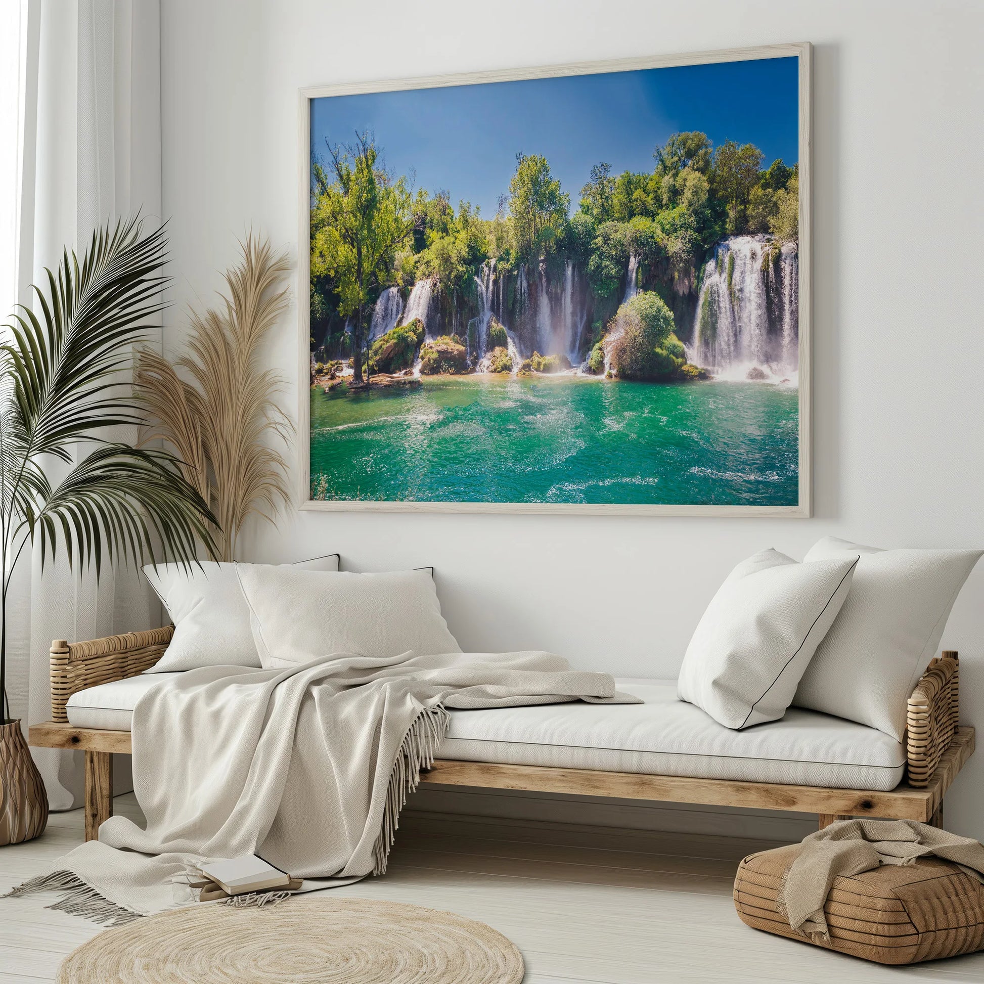 A modern interior featuring the Waterfall Oasis Print, framed and mounted on a minimalist white wall.