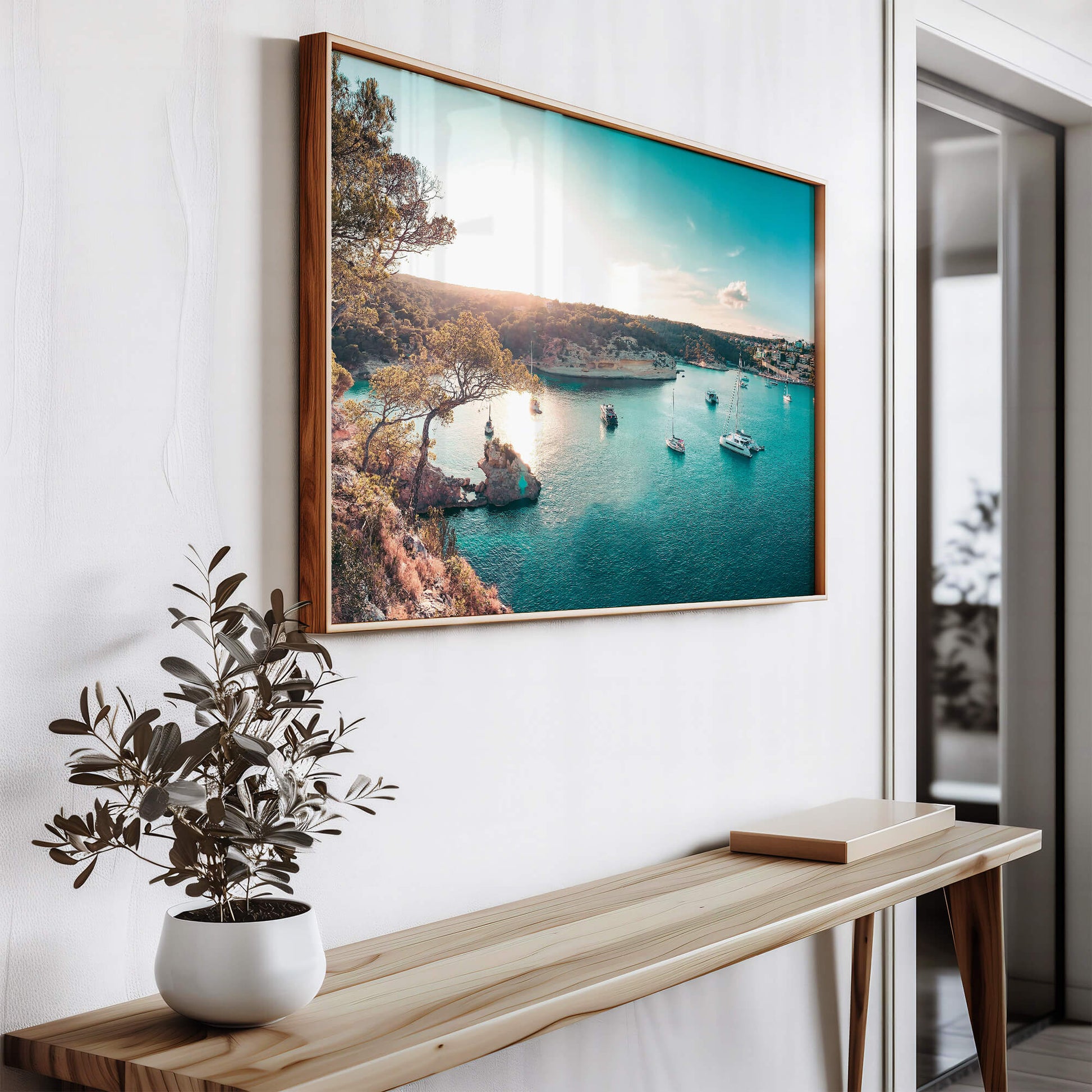 A stylishly framed Yacht Bay Print hanging on a wall above a wooden console, adding a touch of coastal charm to the space.