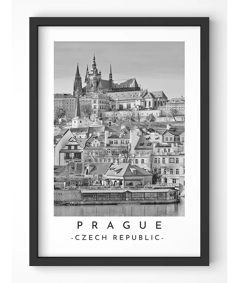 Monochrome photograph of Prague Castle showcasing its architectural grandeur.
