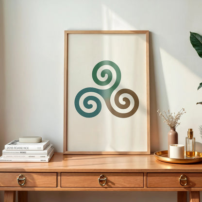 A framed Triple Spiral Triskelion wall art print in a light wood frame, styled on a wooden desk with soft natural light and Irish decor.