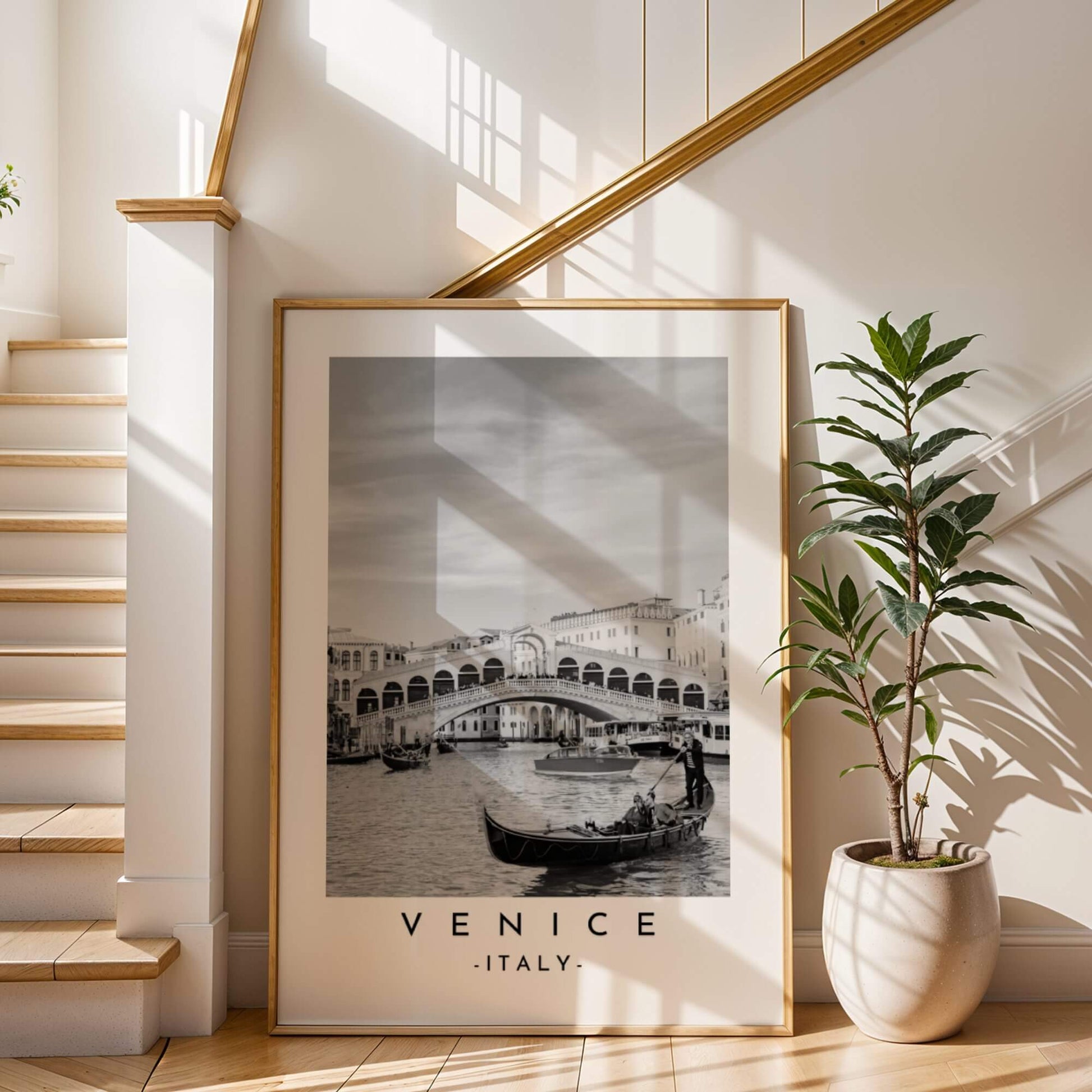 Dramatic black and white print of the Rialto Bridge, showcasing its architectural details and Venetian charm.

