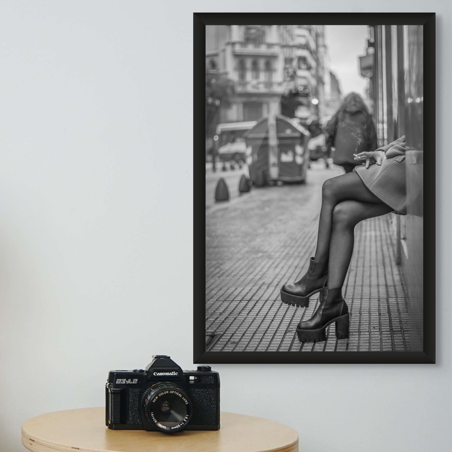 Black and white street style photo of woman in platform boots